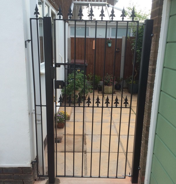Residential side access gate with spear top finials