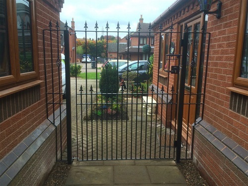 Extra wide bespoke metal gate with matching bespoke side panels