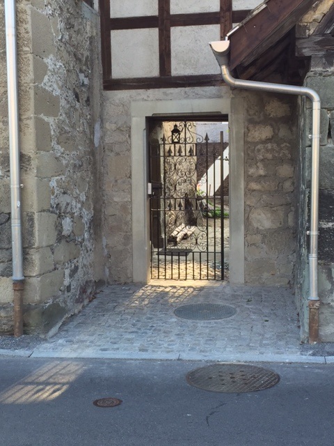 Ornate wrought iron side gate fitted to a pedestrian entrance of a holiday chalet