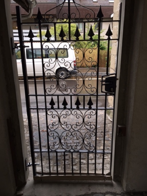 Decorative iron side gate with a heavy duty lock