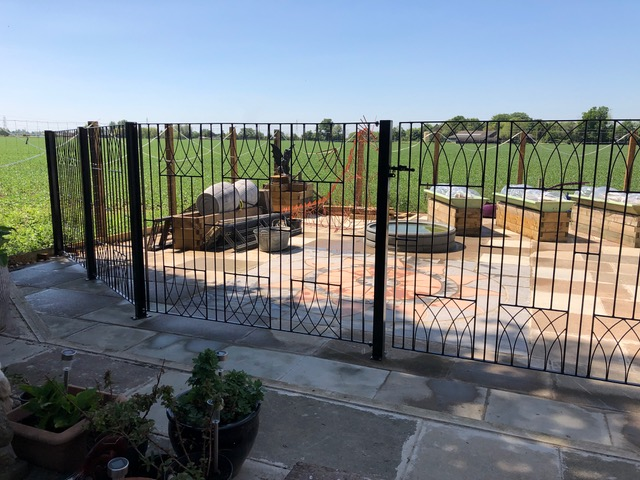 Bespoke abbey metal gate with additional fence panels