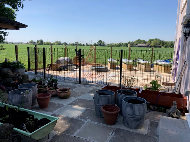 Abbey metal garden fencing and gate installed onto residential patio