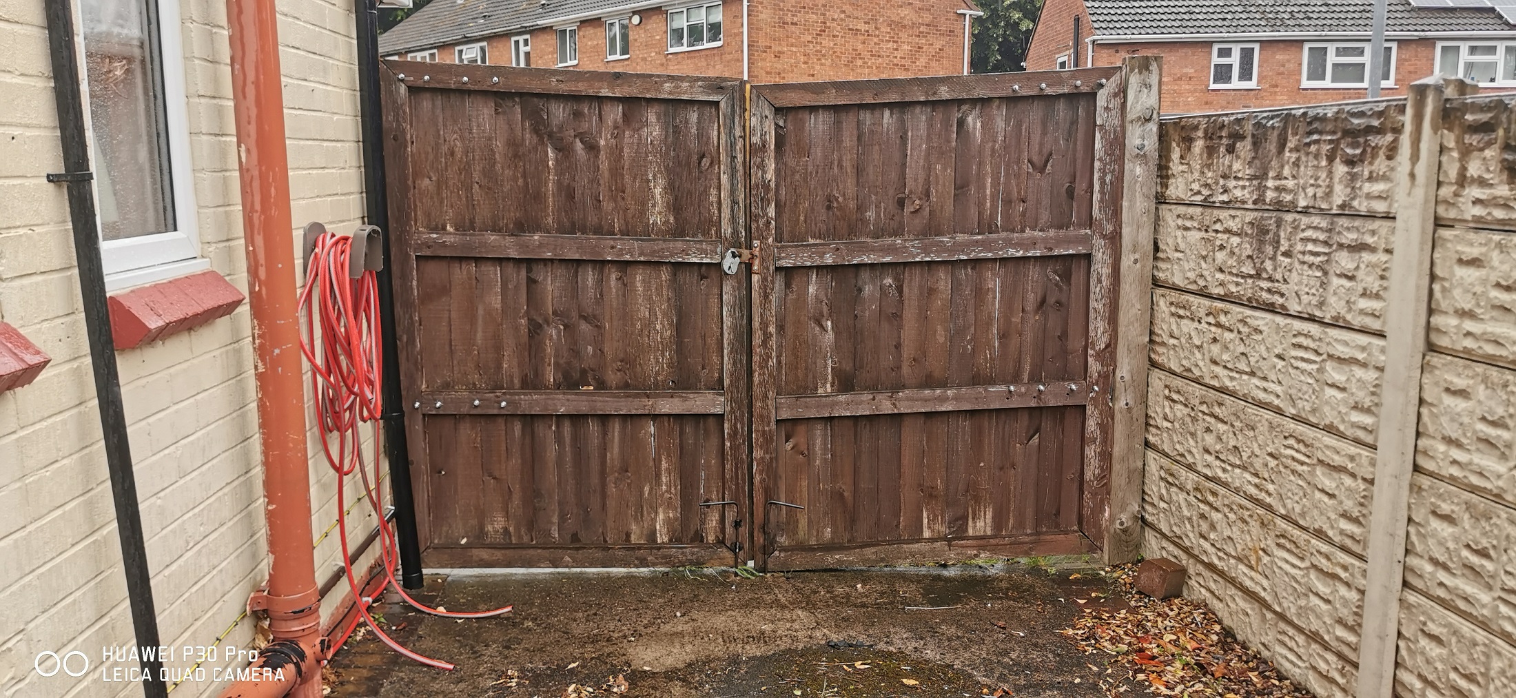 Existing wooden gates with a weathered finish